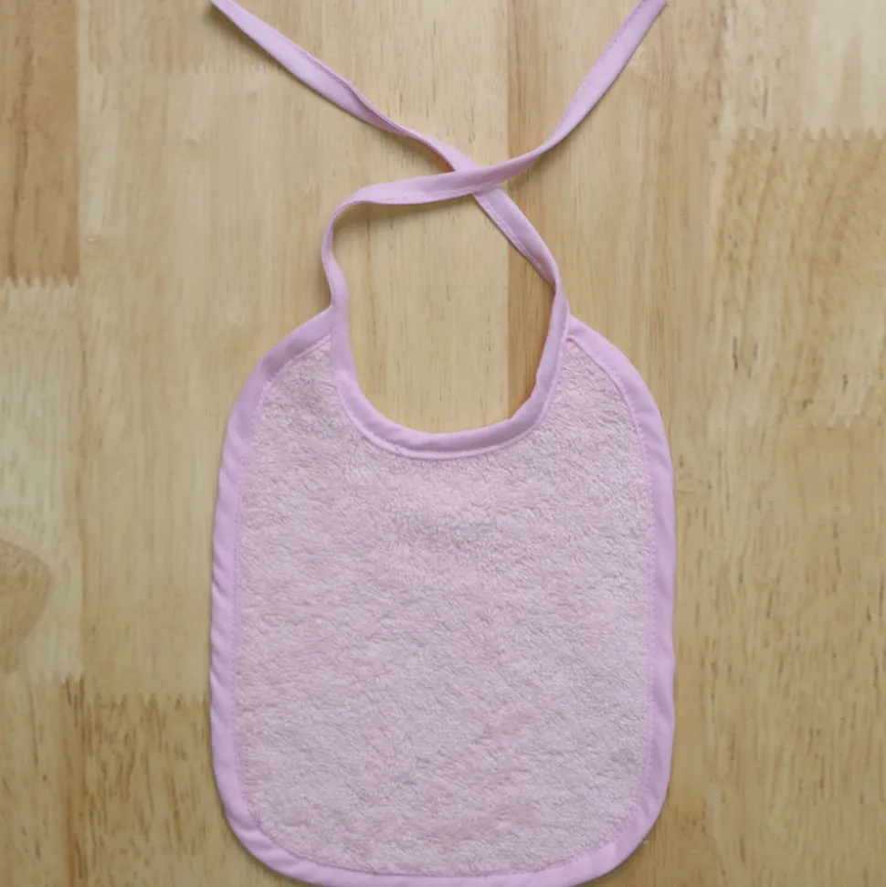 Babero rizo liso rosa 25x30