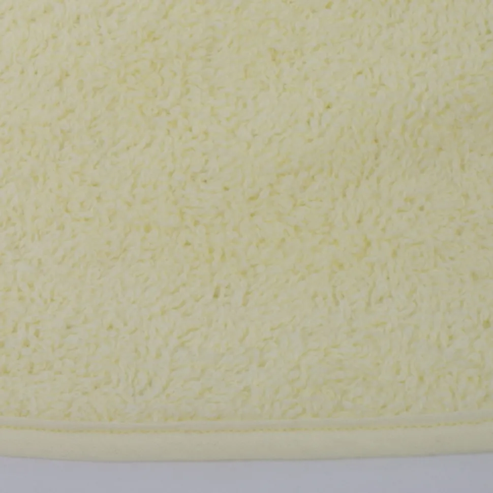 Babero rizo plastico con goma amarillo