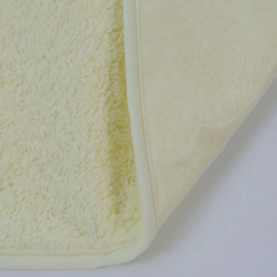Babero rizo plastico con goma amarillo