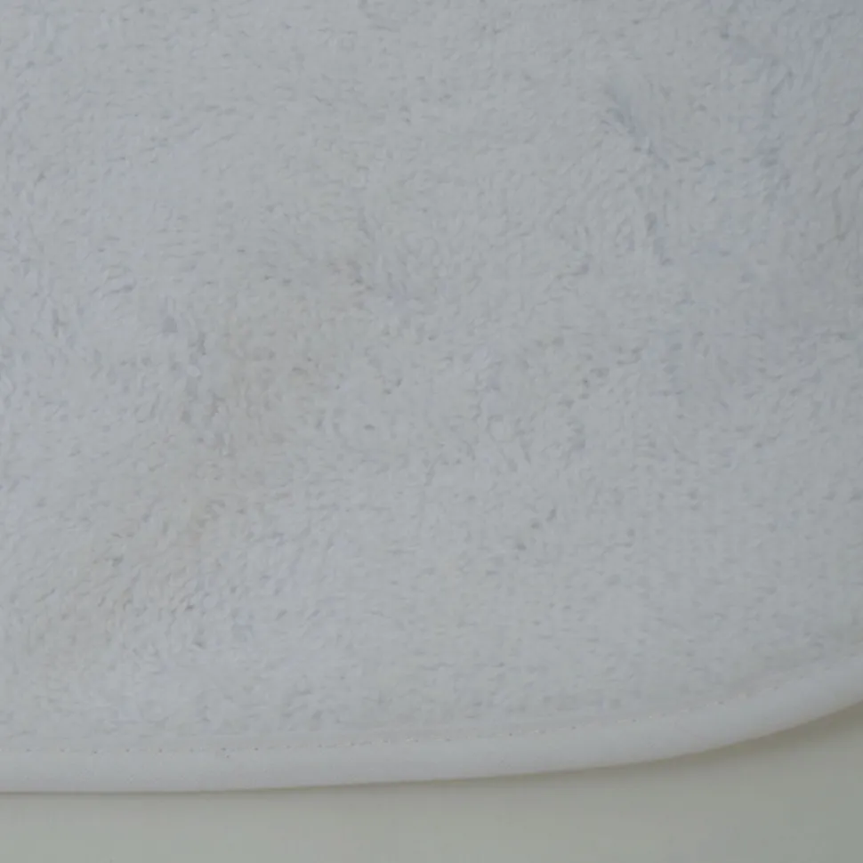 Babero rizo plastico con goma blanco