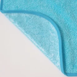 Babero rizo plastico con goma turquesa